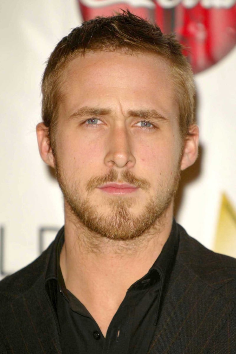 Ryan Gosling with a short textured crew cut featuring spiky upward-styled top and closely cropped sides