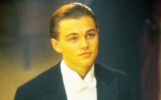Leonardo DiCaprio with sleek side-parted slicked back hairstyle at formal event, modern era