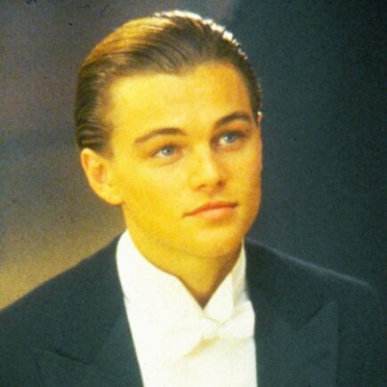 Leonardo DiCaprio with sleek side-parted slicked back hairstyle at formal event, modern era