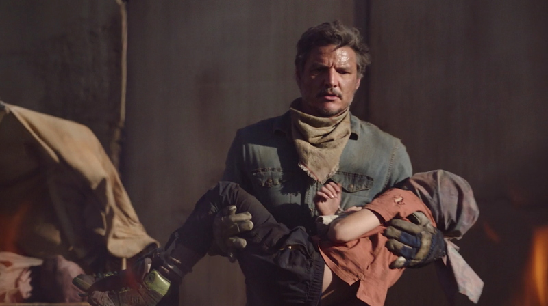 Pedro Pascal as Joel Miller in The Last of Us with rugged tousled medium length wavy hair falling messy around his face in a survivalist look