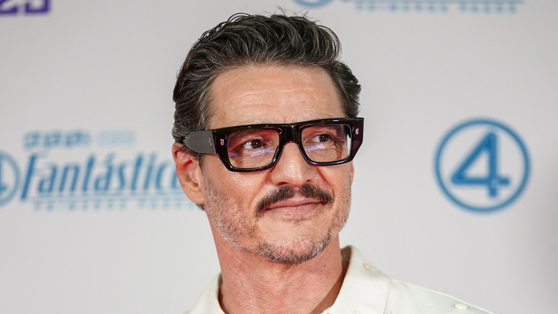 Pedro Pascal modern textured short haircut with swept back style and fade on sides and back creating a sharp polished silhouette