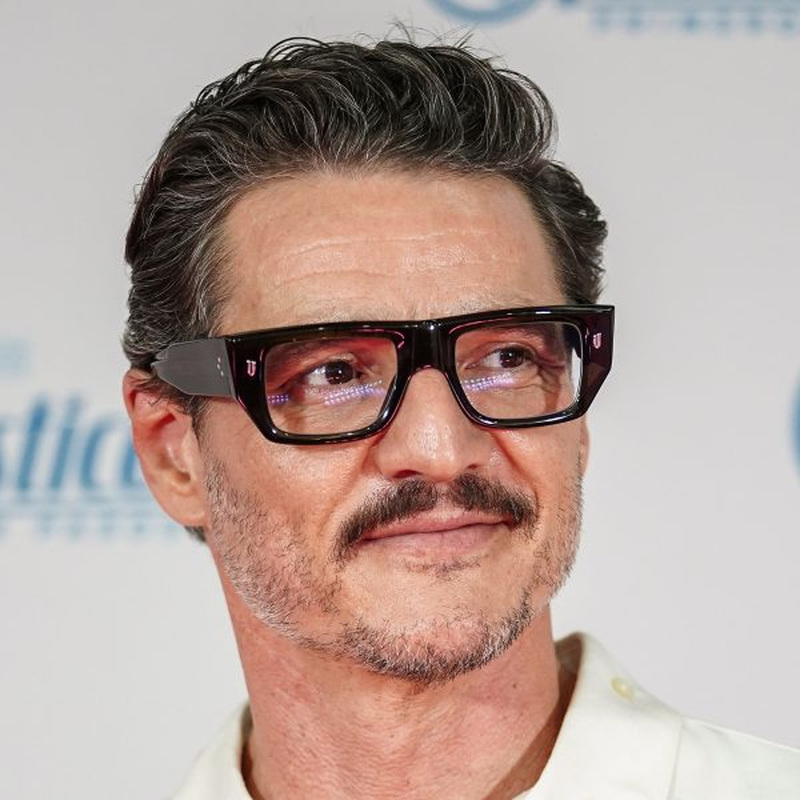 Pedro Pascal's styled wavy swept-back textured quiff with subtle gray tones as Joel Miller in The Last of Us