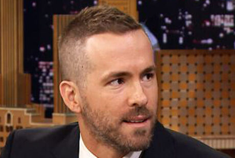 Ryan Reynolds Deadpool haircut with clean fade sides and longer textured top styled upward