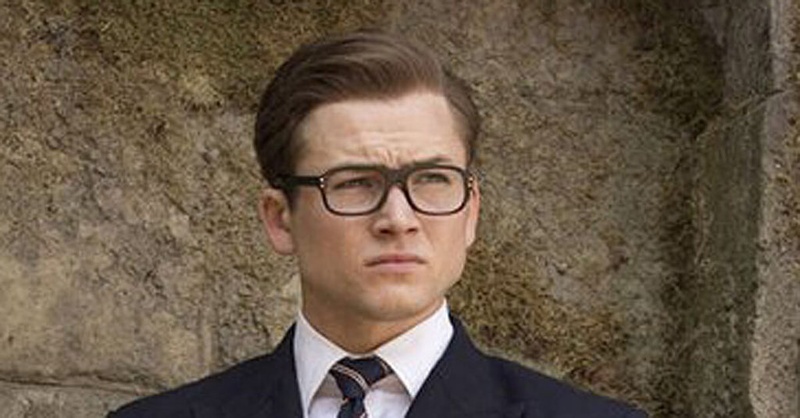 Taron Egerton Eggsy haircut in Kingsman showing classic side part with tapered sides