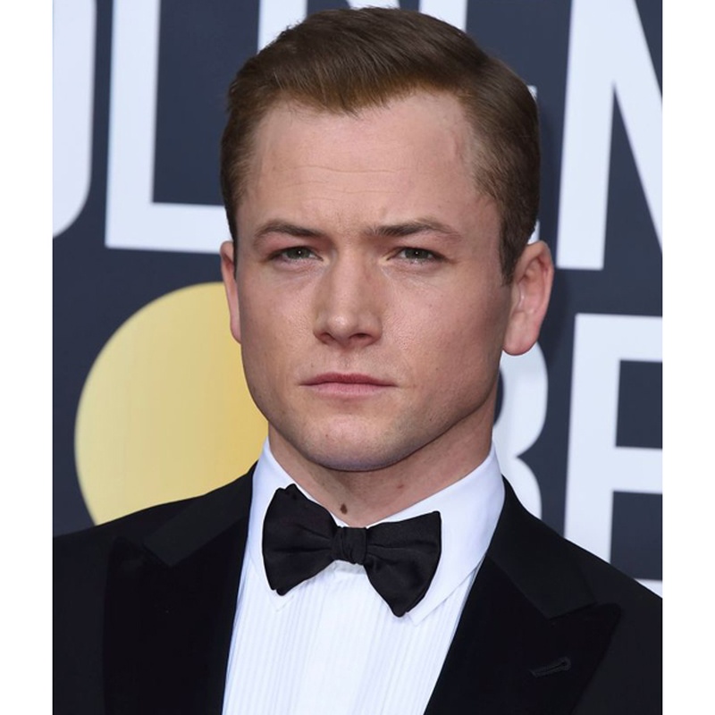 Taron Egerton Golden Globes slicked-back hairstyle styled with pomade