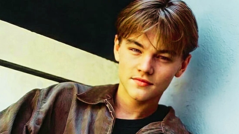 Teenage Leonardo DiCaprio with tousled layered shaggy 90s curtain hairstyle