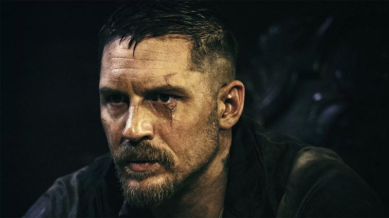 Tom Hardy Taboo hairstyle featuring a textured crew cut with sharp fade and stubble